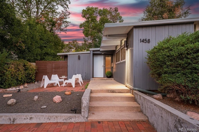 view of exterior entry at dusk