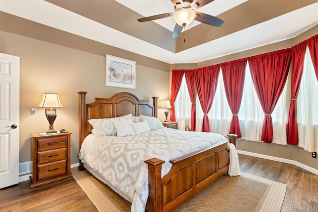 bedroom with ceiling fan and hardwood / wood-style floors