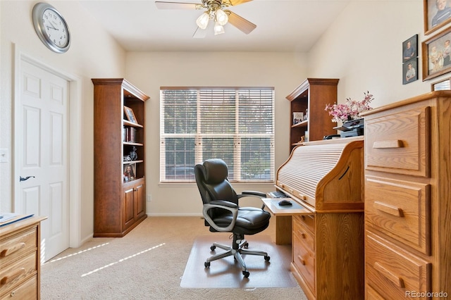 office space featuring ceiling fan and light colored carpet