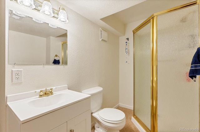 bathroom with vanity, a shower with shower door, toilet, and a textured ceiling