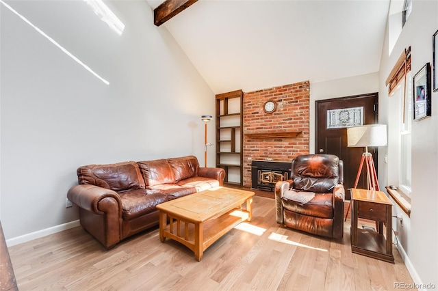 living area featuring light wood-type flooring, baseboards, high vaulted ceiling, and beamed ceiling