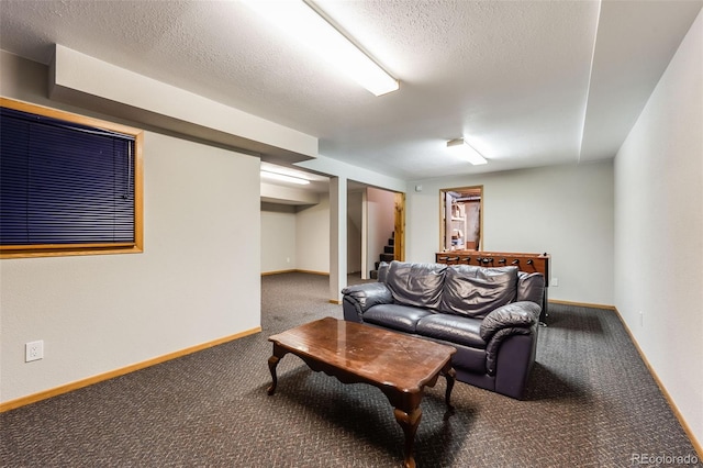 carpeted living room with baseboards, a textured ceiling, and stairs