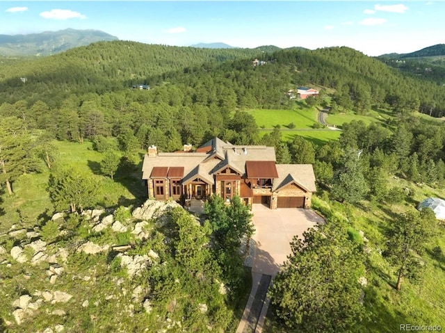 birds eye view of property with a mountain view