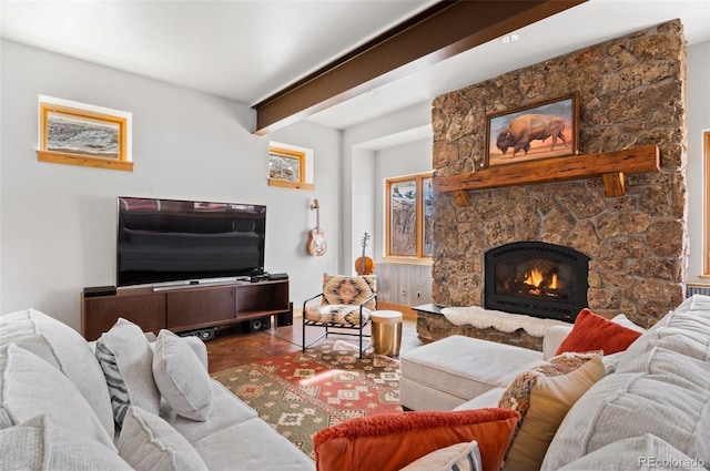 living room featuring a fireplace and beamed ceiling