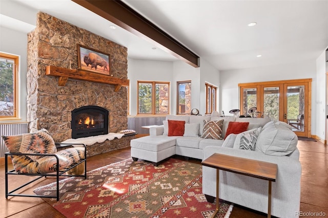 living room with a fireplace and beam ceiling