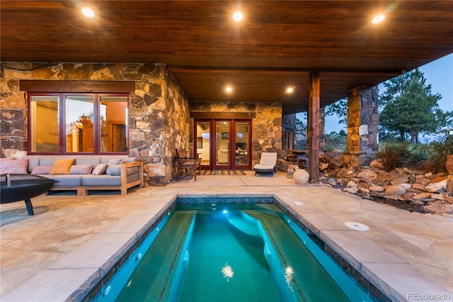 view of pool featuring a patio, a hot tub, and outdoor lounge area