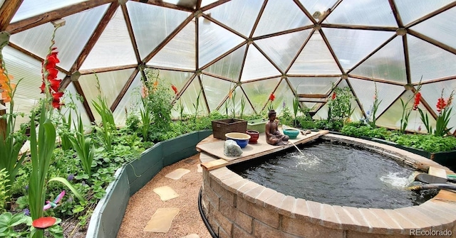 exterior space with pool water feature and an outdoor structure