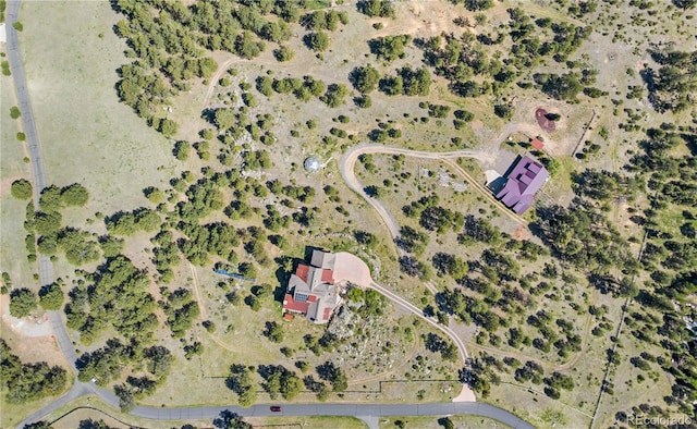 birds eye view of property featuring a rural view