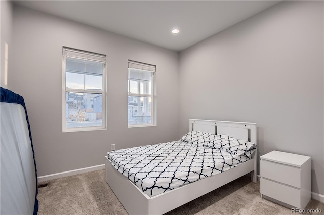 bedroom with light colored carpet