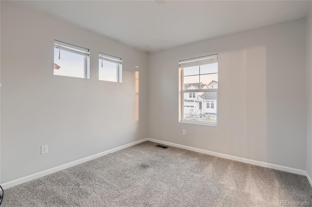 empty room featuring carpet flooring