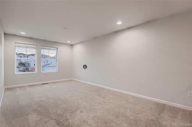 unfurnished room featuring carpet flooring