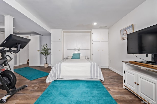 bedroom featuring baseboards, recessed lighting, dark wood-type flooring, and visible vents