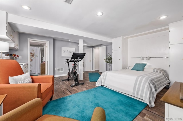 bedroom featuring baseboards, recessed lighting, wood finished floors, and visible vents