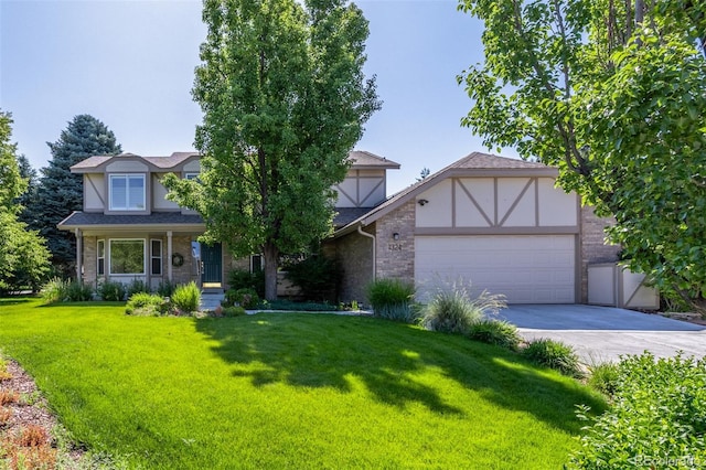 1324 Shadow Mountain Dr, Highlands Ranch, CO 80126 - tudor home featuring a front yard, an attached garage, concrete driveway, and brick siding