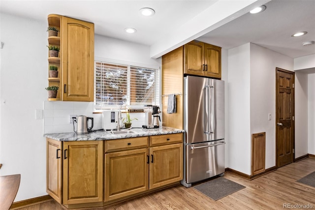 1324 Shadow Mountain Dr, Highlands Ranch, CO 80126 - kitchen featuring high end refrigerator, open shelves, light wood finished floors, light stone counters, and recessed lighting