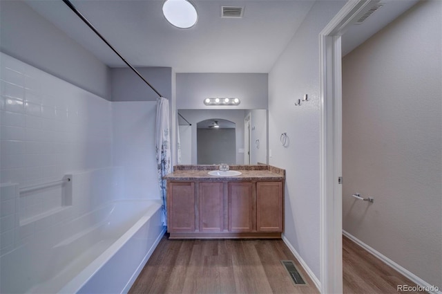 5336 Blair Vw, Colorado Springs, CO 80916 - bathroom featuring visible vents, shower / bathtub combination with curtain, vanity, and wood finished floors