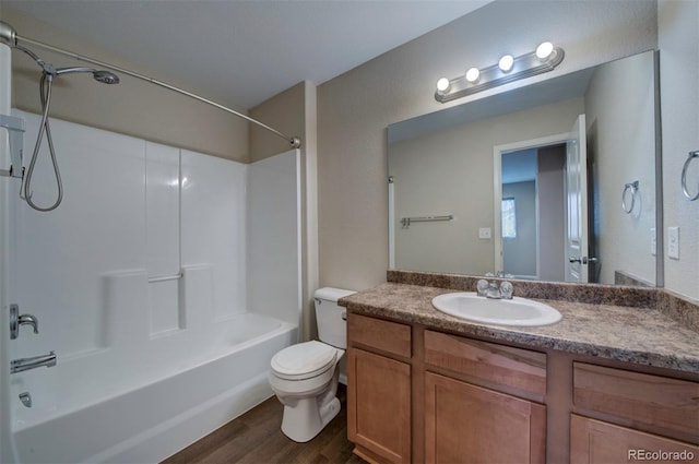 5336 Blair Vw, Colorado Springs, CO 80916 - bathroom featuring vanity, bathtub / shower combination, wood finished floors, and toilet