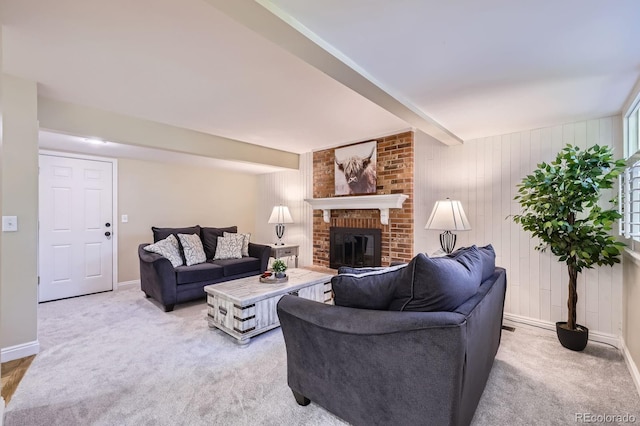 8985 W Quarto Pl, Littleton, CO 80128 - living room featuring a fireplace, light carpet, and beam ceiling