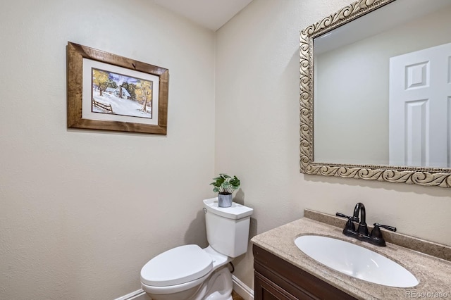 8985 W Quarto Pl, Littleton, CO 80128 - bathroom featuring toilet and vanity