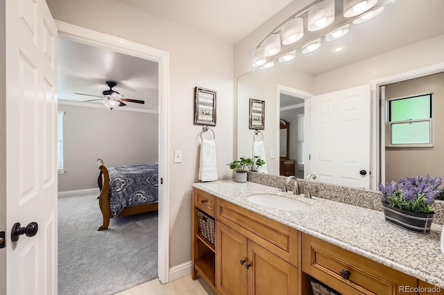 8985 W Quarto Pl, Littleton, CO 80128 - bathroom with vanity, a ceiling fan, and ensuite bathroom