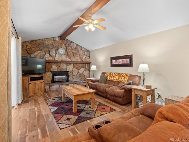 living room featuring a fireplace, hardwood / wood-style floors, lofted ceiling with beams, and ceiling fan