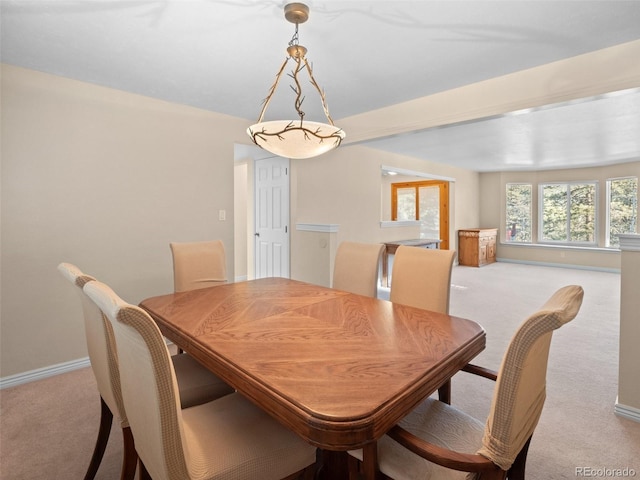 dining room with light carpet