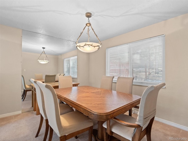 view of carpeted dining space