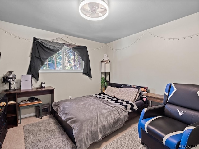 bedroom featuring light colored carpet