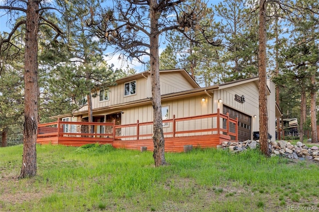 28735 Little Big Horn Dr, Evergreen, CO 80439 - back of house featuring a garage and a wooden deck