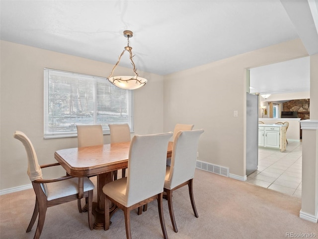 28735 Little Big Horn Dr, Evergreen, CO 80439 - dining room with light colored carpet, baseboards, and light tile patterned floors