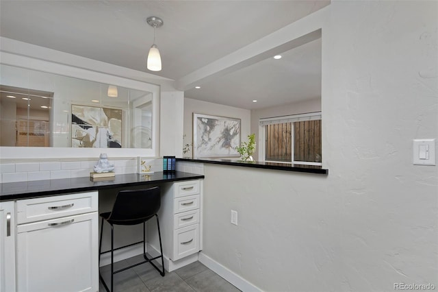 bathroom featuring tasteful backsplash and tile patterned floors