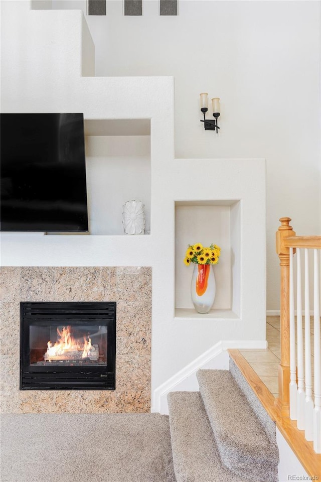 details featuring a high end fireplace