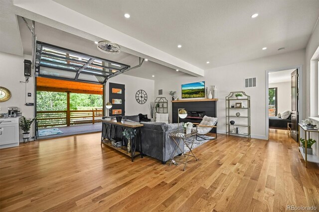 14950 W 32nd Ave, Golden, CO 80401 - living area featuring light wood-style flooring, plenty of natural light, and recessed lighting