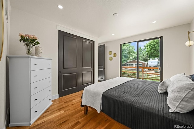 14950 W 32nd Ave, Golden, CO 80401 - bedroom featuring light wood-type flooring, recessed lighting, and access to outside