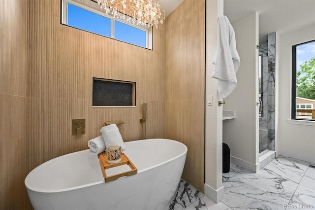 14950 W 32nd Ave, Golden, CO 80401 - full bathroom with marble finish floors, a chandelier, healthy amount of natural light, and a shower stall