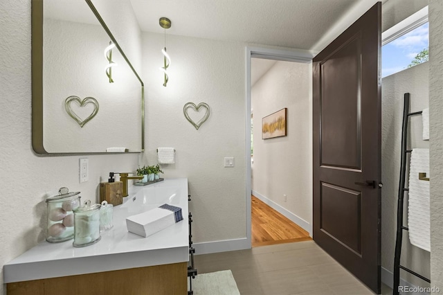 14950 W 32nd Ave, Golden, CO 80401 - bathroom with vanity and wood finished floors