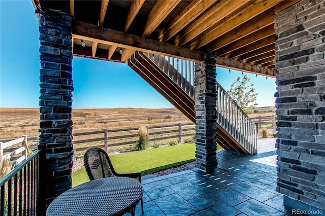 view of patio with a rural view