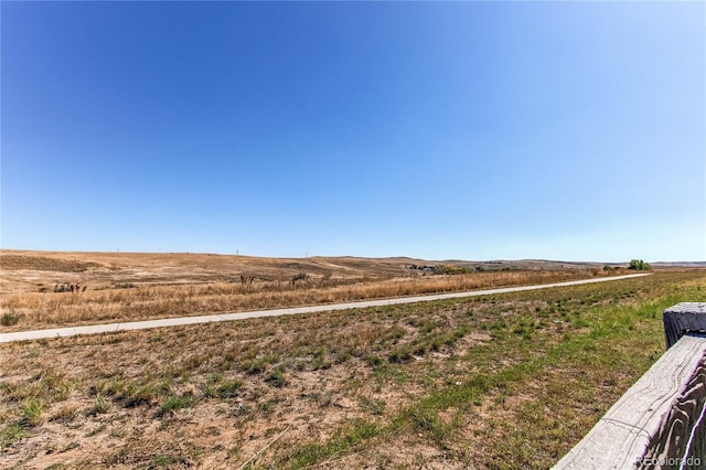 view of yard with a rural view