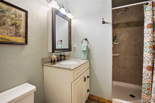 34 Nebraska Cir, Florissant, CO 80816 - bathroom featuring toilet, vanity, and a stall shower