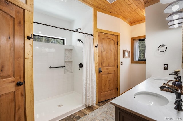 34 Nebraska Cir, Florissant, CO 80816 - full bath with wooden ceiling, wood finished floors, a sink, and a tile shower