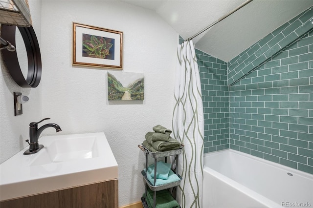 34 Nebraska Cir, Florissant, CO 80816 - full bath featuring shower / tub combo, vaulted ceiling, and vanity