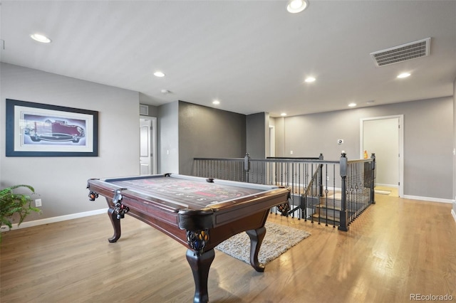 recreation room featuring recessed lighting, light wood-type flooring, visible vents, and baseboards