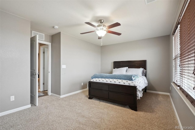 bedroom featuring a ceiling fan, visible vents, light carpet, and baseboards