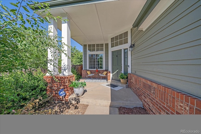 10421 Kennemere Ln, Parker, CO 80134 - doorway to property with covered porch and brick siding