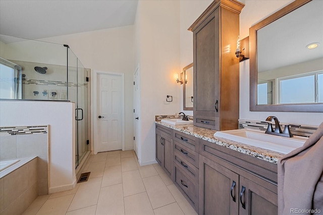 10421 Kennemere Ln, Parker, CO 80134 - bathroom featuring double vanity, a shower stall, tile patterned flooring, and a bath