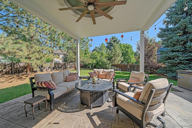 10421 Kennemere Ln, Parker, CO 80134 - fenced backyard with an outdoor hangout area, ceiling fan, and a patio area