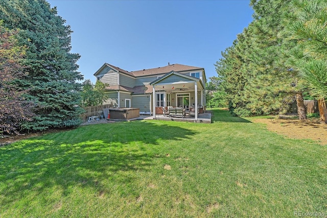 10421 Kennemere Ln, Parker, CO 80134 - rear view of house featuring a hot tub, a patio, and ceiling fan