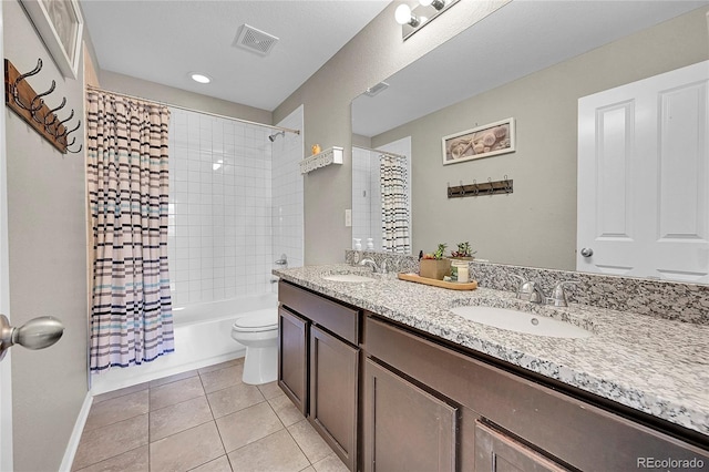 full bathroom with tile patterned flooring, shower / bath combo, vanity, and toilet