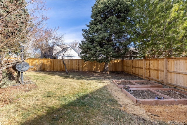 view of yard featuring a garden and fence