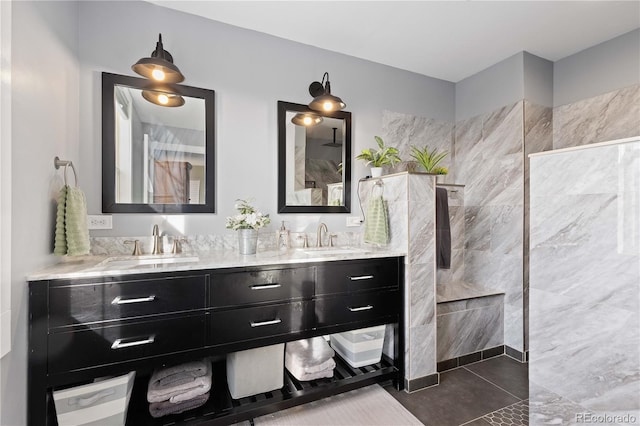 full bath featuring a sink, walk in shower, and double vanity